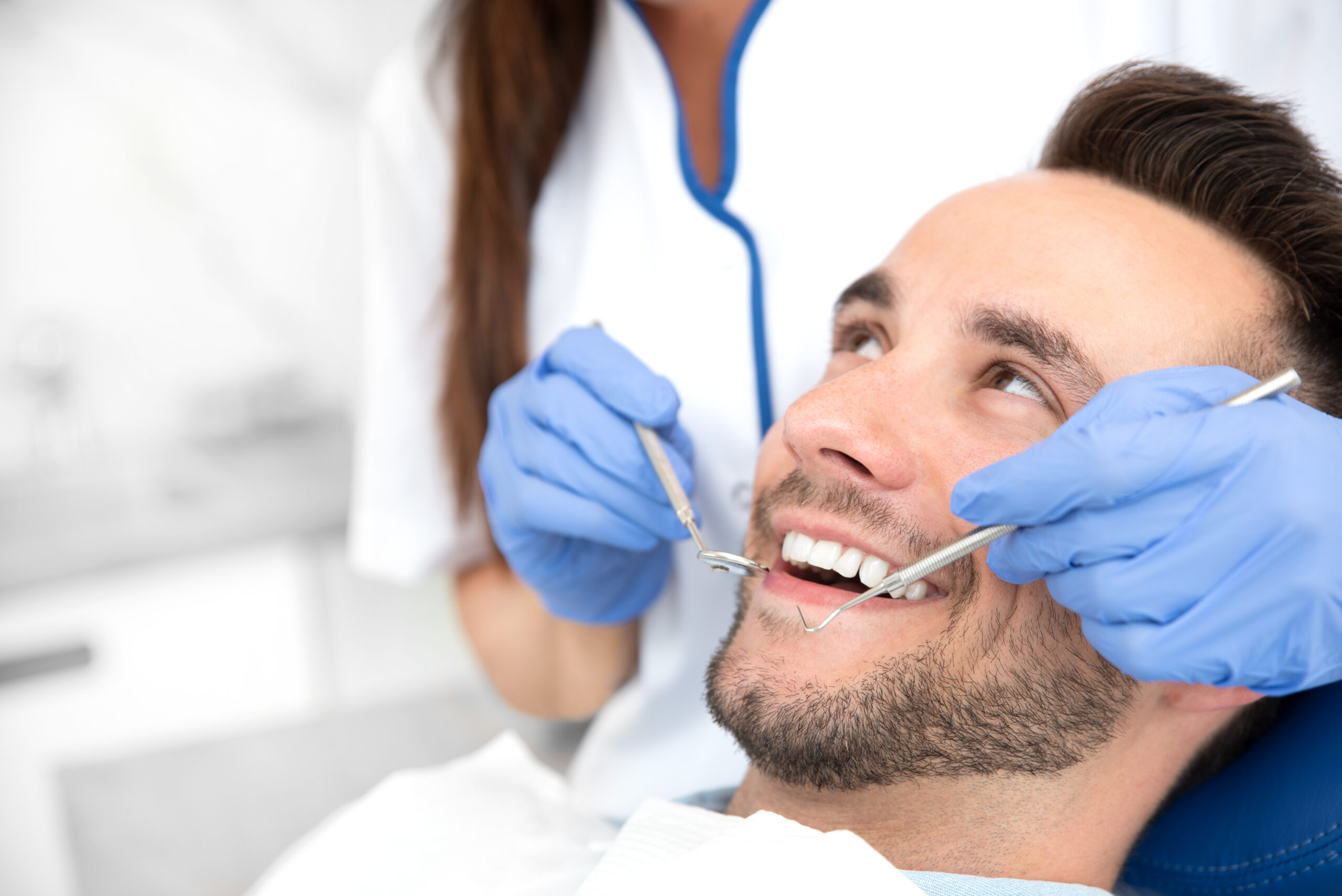 Dr. Brittany Wood performing dental exam at Shoreline Dentistry Virginia Beach