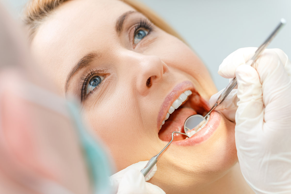 Dr. Brittany Wood performing dental exam at Shoreline Dentistry Virginia Beach