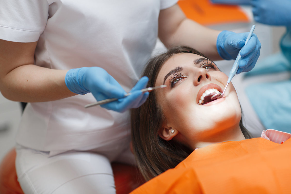Dental clinic. Reception, examination of the patient. Teeth care family smiling after preventive dentistry appointment at Shoreline Dentistry Virginia Beach