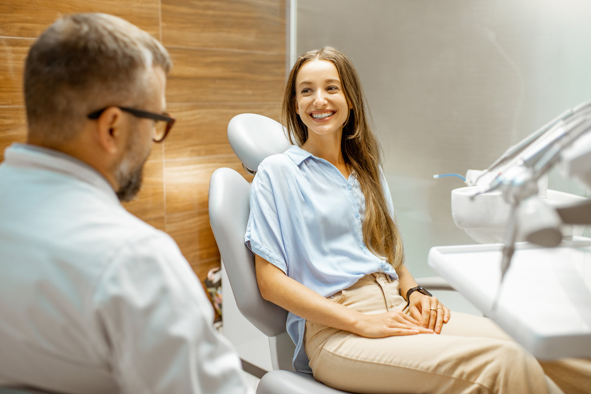 Young patient with senior dentist during a medical consultation at the dental office preventive dentistry patient consultation Virginia Beach